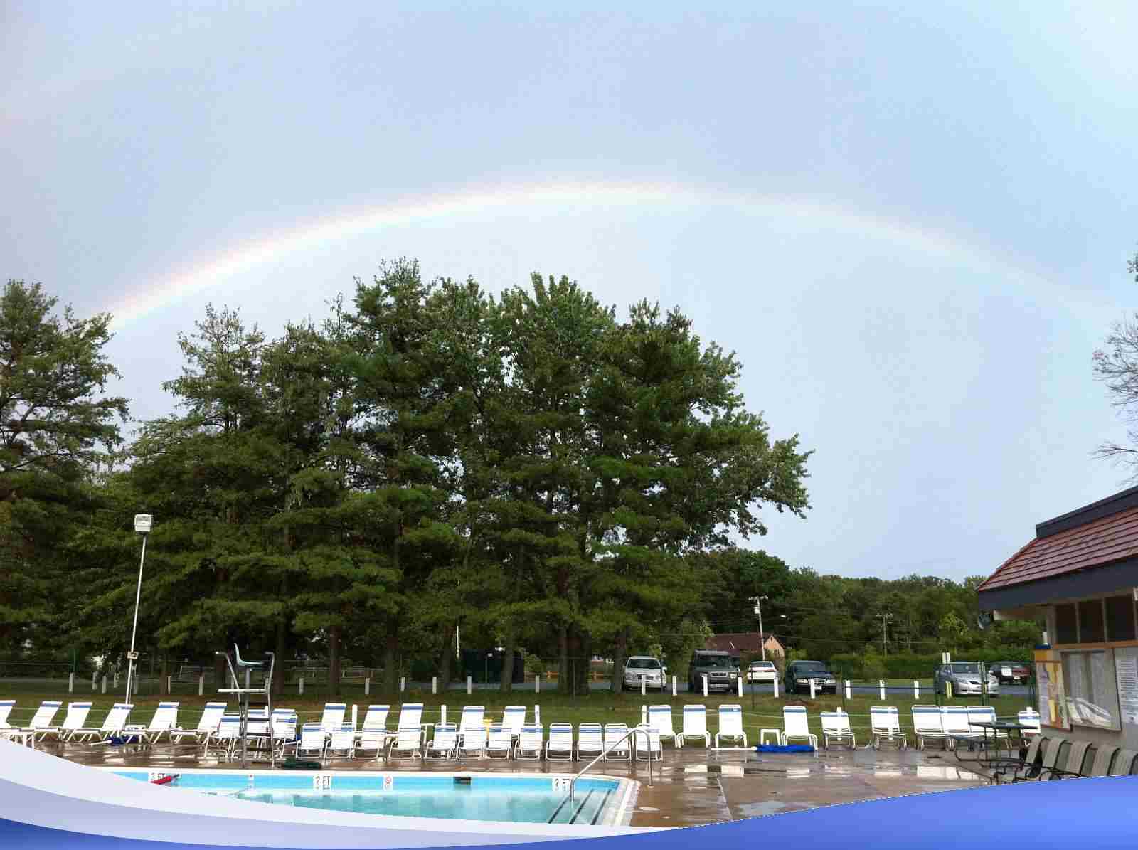 A rainbow over our pool. It's a sign that you should join.